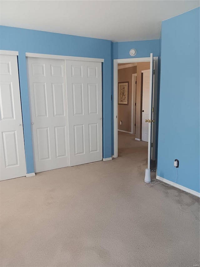 unfurnished bedroom with light carpet