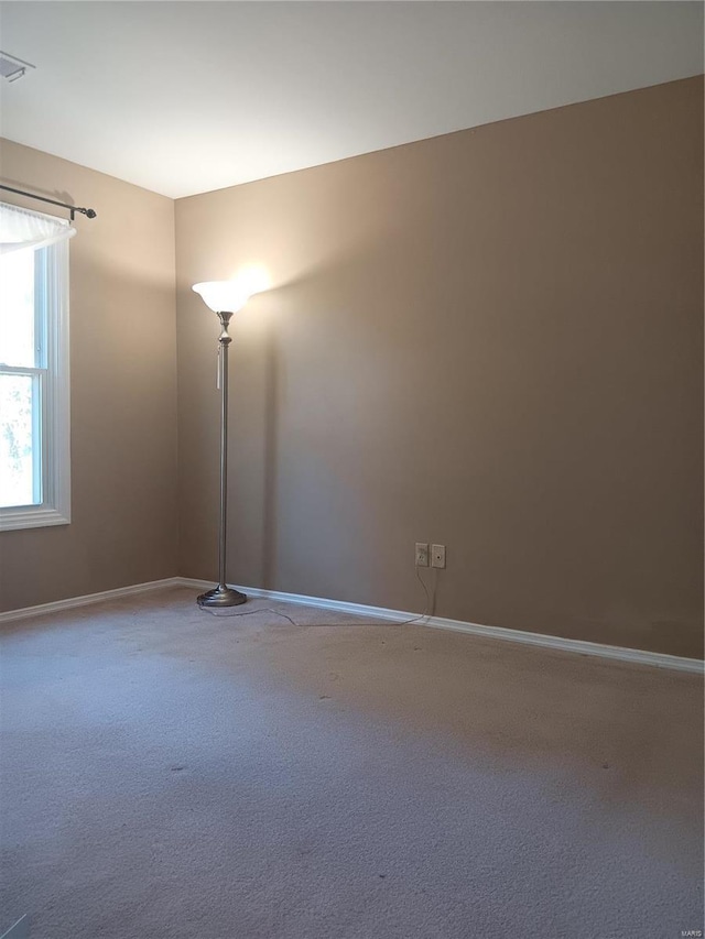 empty room with carpet flooring