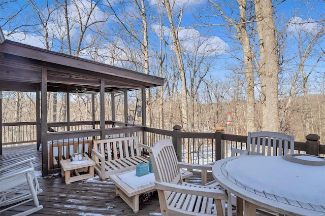 wooden deck featuring ceiling fan