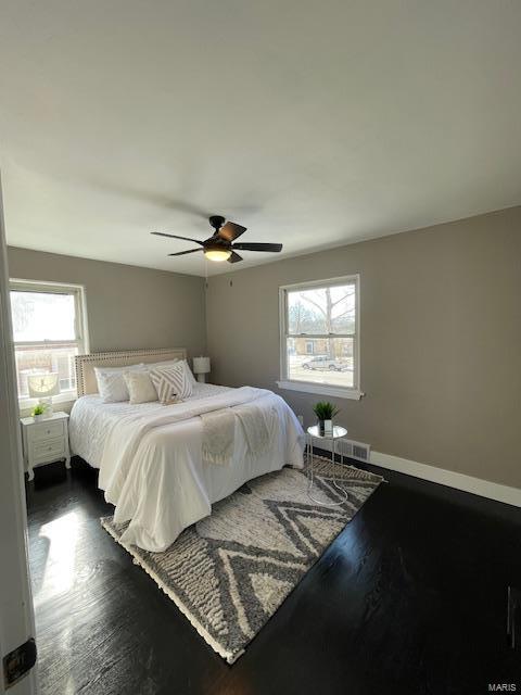 bedroom featuring dark wood-type flooring and ceiling fan