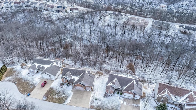 snowy aerial view featuring a residential view