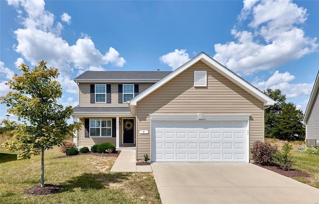 view of front of property with a garage and a front lawn