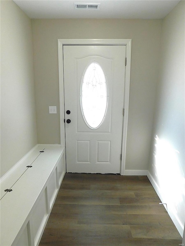 entryway featuring dark wood-style flooring and visible vents