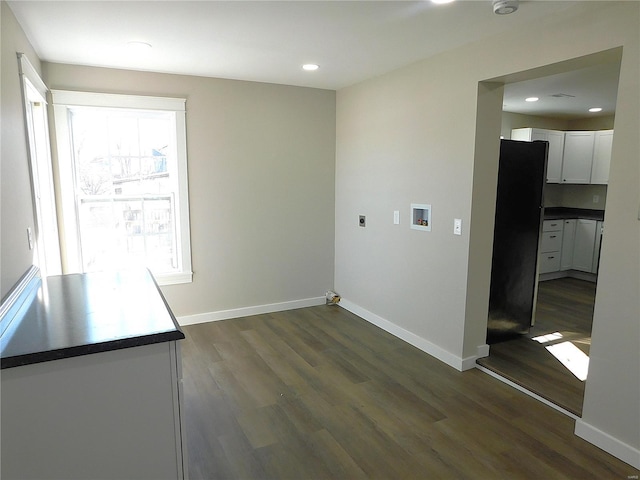 clothes washing area featuring laundry area, hookup for a washing machine, dark wood-type flooring, and hookup for an electric dryer