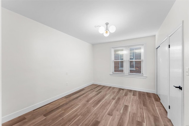 spare room featuring light hardwood / wood-style floors