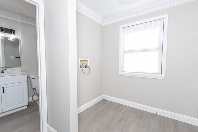 bathroom featuring ornamental molding, vanity, toilet, and hardwood / wood-style floors