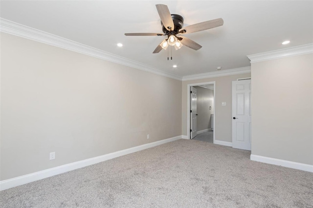 carpeted empty room with ceiling fan and ornamental molding