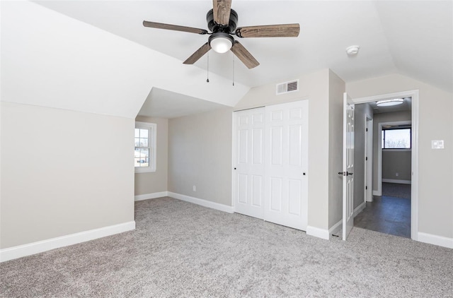 bonus room with vaulted ceiling, carpet floors, and ceiling fan