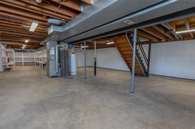 basement featuring heating unit and gas water heater