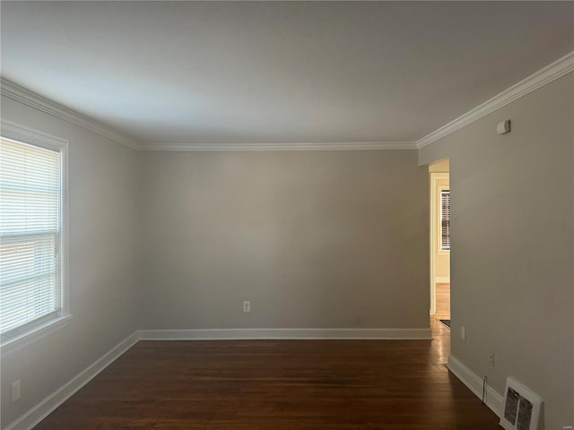 unfurnished room with ornamental molding and dark hardwood / wood-style floors