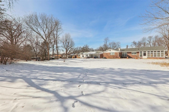 view of yard covered in snow