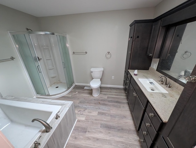 full bathroom featuring hardwood / wood-style flooring, toilet, vanity, and plus walk in shower