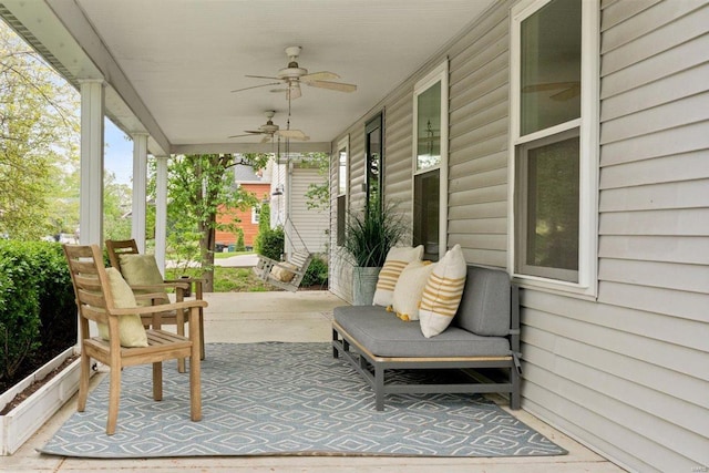 view of patio featuring a ceiling fan and a porch