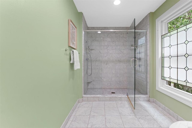 full bath with baseboards, recessed lighting, marble finish floor, and a stall shower
