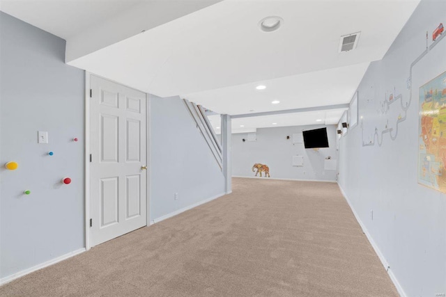 finished below grade area with baseboards, carpet flooring, recessed lighting, and visible vents
