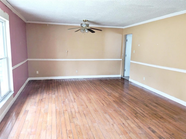 unfurnished room featuring a textured ceiling, ceiling fan, crown molding, and hardwood / wood-style floors