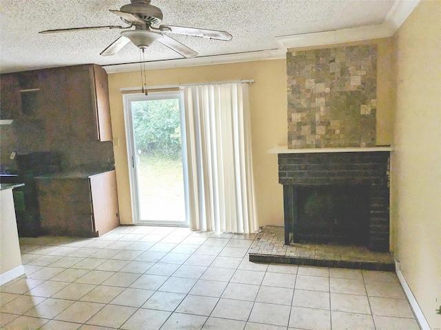 unfurnished living room with ceiling fan, light tile patterned flooring, and a textured ceiling