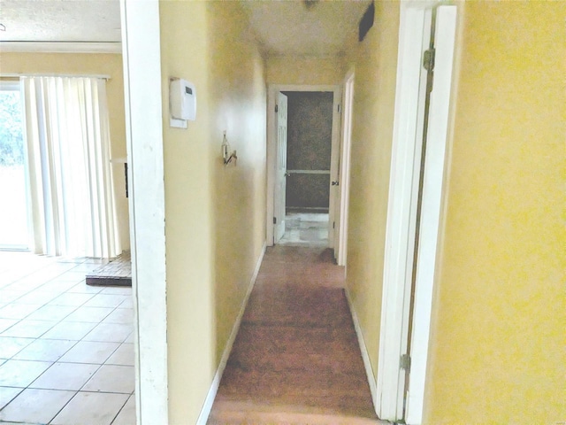 hallway with light tile patterned floors