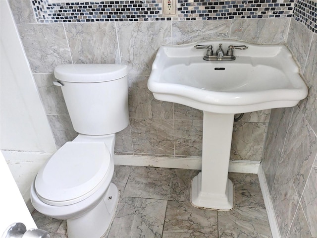 bathroom featuring toilet