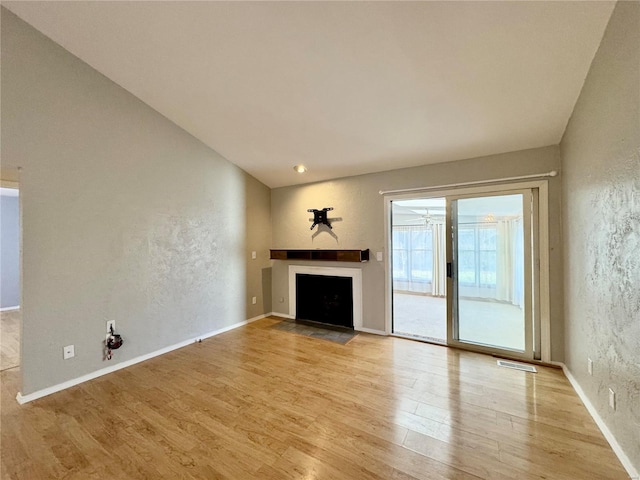 unfurnished living room featuring light wood-type flooring