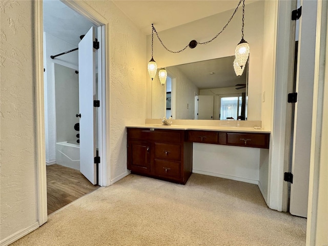 bathroom with vanity and shower / bathing tub combination