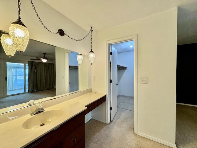 bathroom featuring ceiling fan and vanity