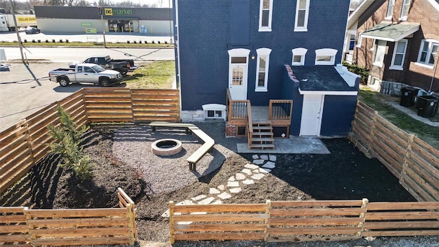 view of yard with an outdoor fire pit