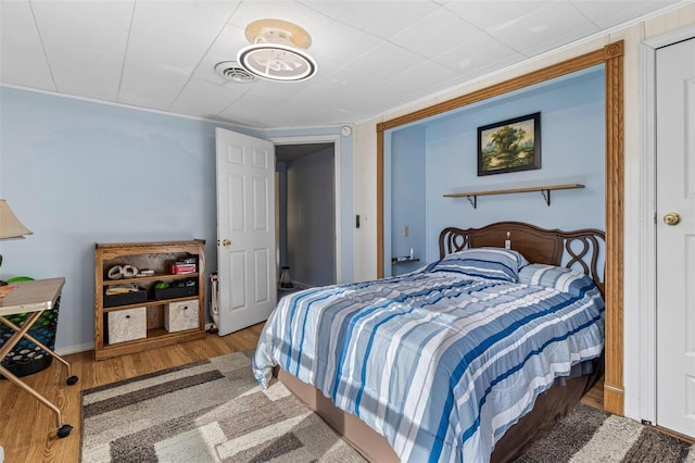 bedroom featuring wood-type flooring