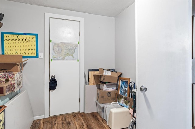 laundry area featuring hardwood / wood-style floors