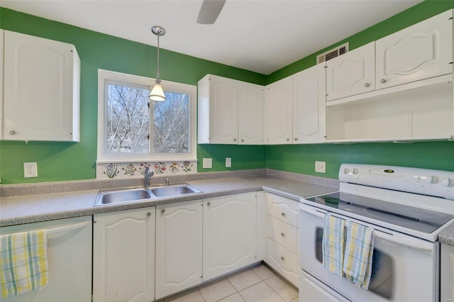 kitchen with white cabinetry, white appliances, and sink