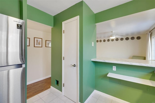 bathroom with tile patterned flooring and ceiling fan