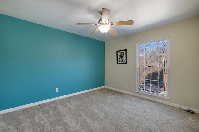 unfurnished room featuring carpet flooring and ceiling fan