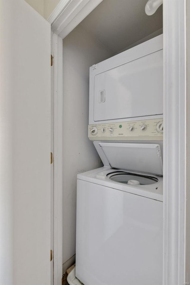 laundry room with stacked washer and clothes dryer