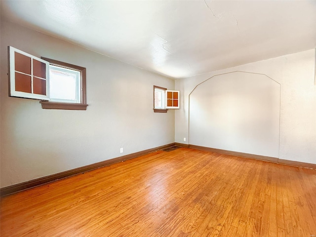 unfurnished room with light hardwood / wood-style floors