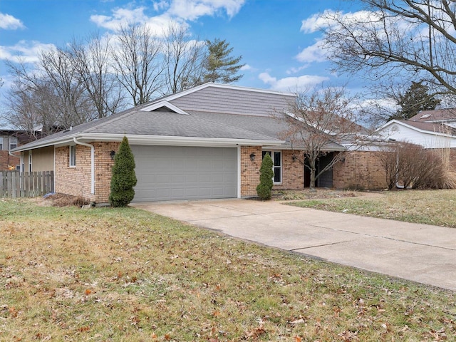 ranch-style home with a garage and a front yard