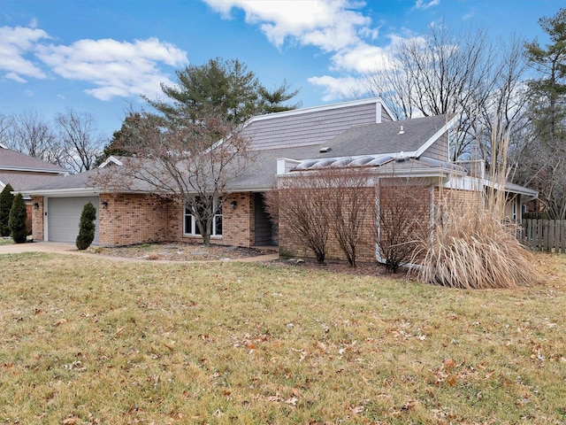 exterior space with a garage and a front yard