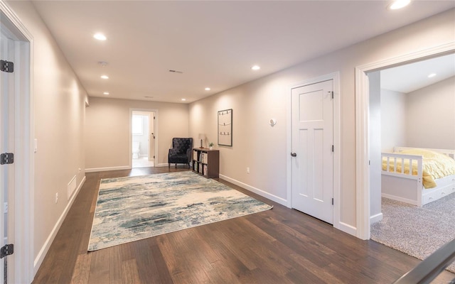 hall with dark wood-type flooring