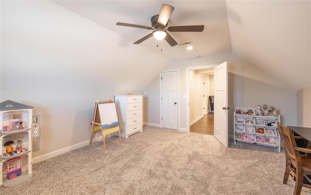 recreation room featuring carpet flooring, vaulted ceiling, and ceiling fan