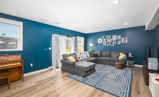 living room with light hardwood / wood-style flooring