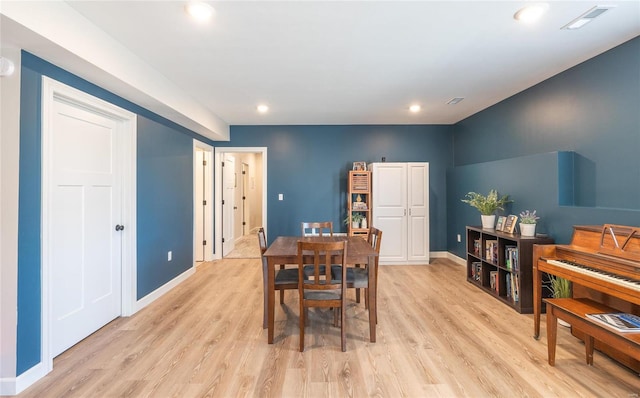 dining space featuring light hardwood / wood-style floors