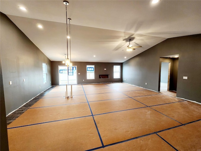 interior space featuring vaulted ceiling and ceiling fan