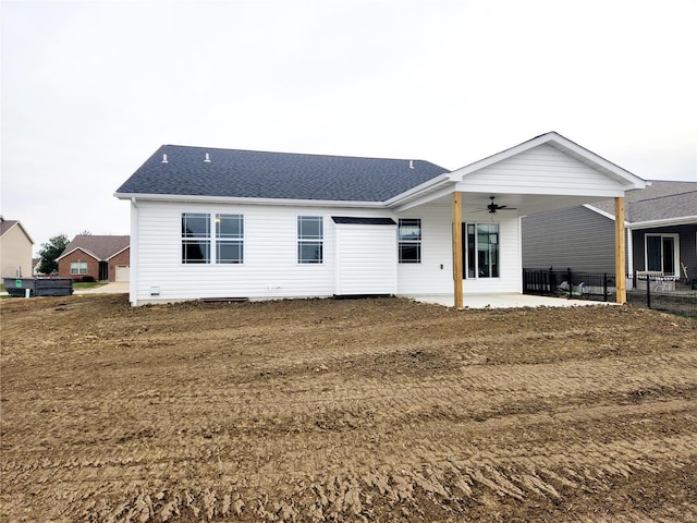 back of property featuring ceiling fan and a patio