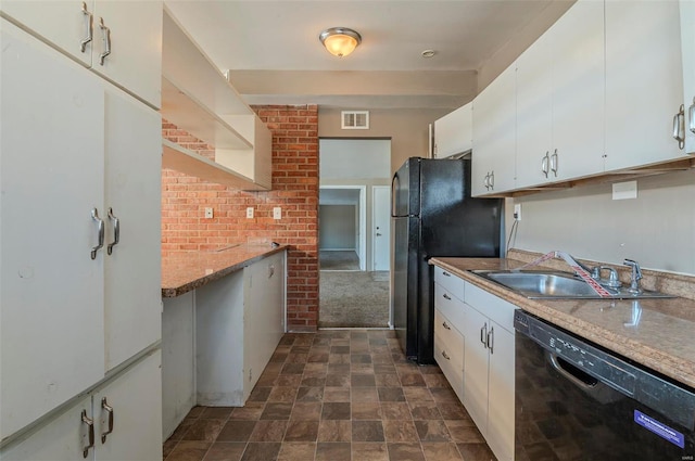 kitchen with white cabinets, light stone countertops, sink, and black appliances