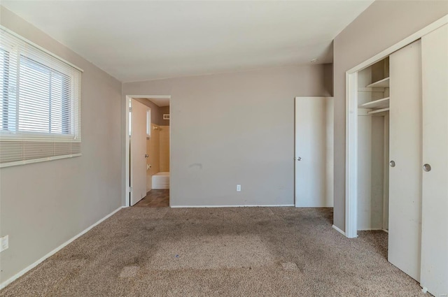 unfurnished bedroom featuring light carpet, connected bathroom, and a closet