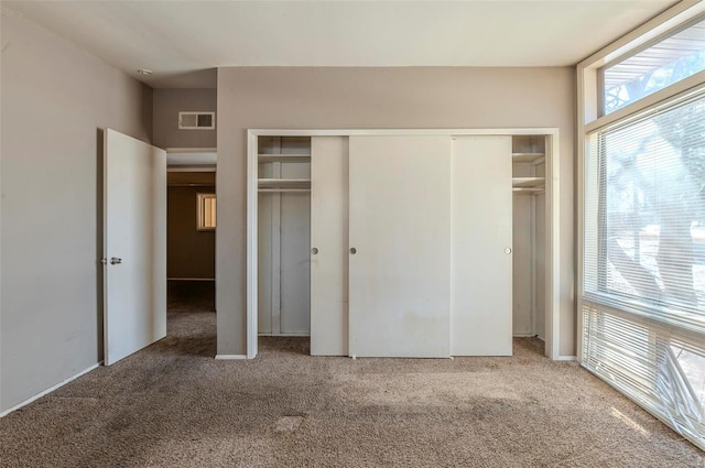 unfurnished bedroom with carpet flooring