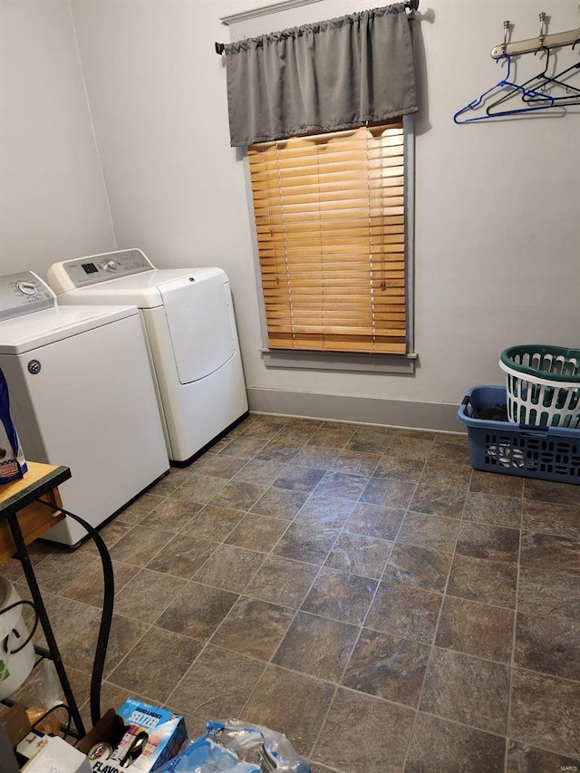 laundry room with washing machine and clothes dryer