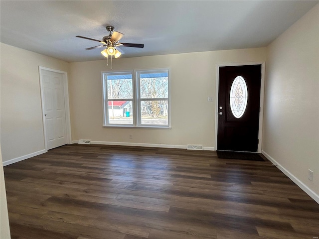 entrance foyer featuring dark wood-style flooring, visible vents, and plenty of natural light