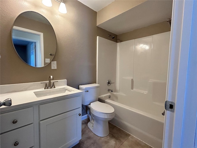 full bath featuring a textured wall, toilet, vanity, tub / shower combination, and tile patterned floors