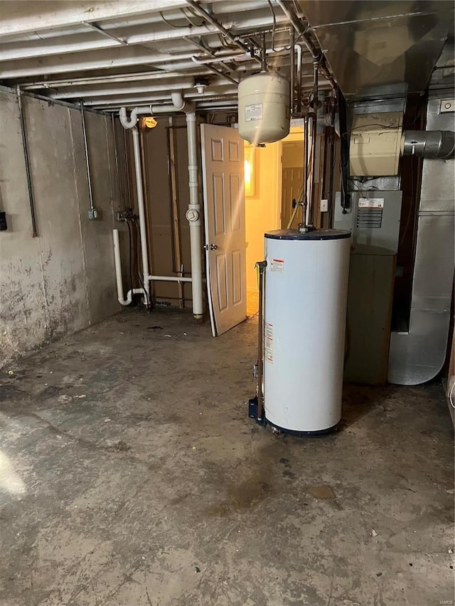 utility room with heating unit and water heater