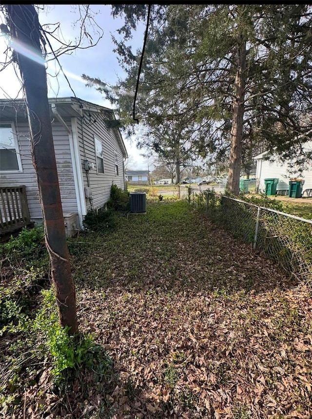 view of yard featuring central air condition unit